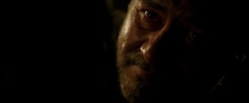 Movie still from “The 33” (2015), directed by Patricia Riggen – A man's face in the dark; Extreme Close Up shot, Over the shoulder angle