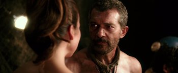 Movie still from “The 33” (2015), directed by Patricia Riggen – A man looking at a woman in a mirror; Close Up shot, Over the shoulder angle