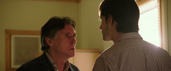 Movie still from “The 33” (2015), directed by Patricia Riggen – A man and a man standing next to each other; Close Up shot, Over the shoulder angle