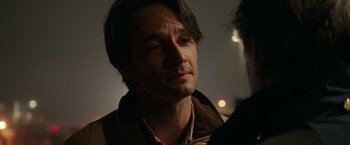 Movie still from “The 33” (2015), directed by Patricia Riggen – A person wearing a jacket; Close Up shot, Over the shoulder angle