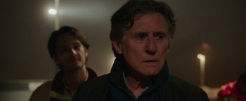 Movie still from “The 33” (2015), directed by Patricia Riggen – A man in a black jacket and a man in a brown jacket; Close Up shot, Over the shoulder angle