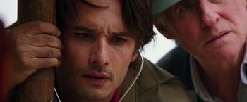 Movie still from “The 33” (2015), directed by Patricia Riggen – A man's face as he stares into the distance; Close Up shot, Over the shoulder angle