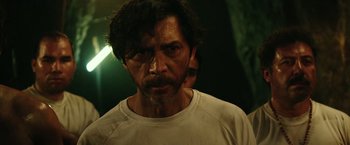 Movie still from “The 33” (2015), directed by Patricia Riggen – A person wearing a white t - shirt; Close Up shot, Over the shoulder angle