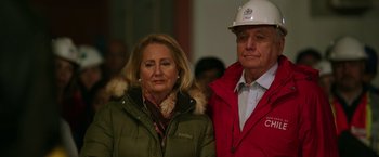 Movie still from “The 33” (2015), directed by Patricia Riggen – A man and a woman standing next to each other; Close Up shot, Low angle