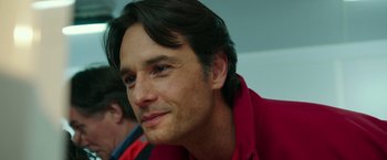 Movie still from “The 33” (2015), directed by Patricia Riggen – A person wearing a red shirt; Close Up shot, Over the shoulder angle