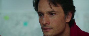 Movie still from “The 33” (2015), directed by Patricia Riggen – A man's face with a blurry background behind it; Close Up shot, Over the shoulder angle