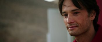 Movie still from “The 33” (2015), directed by Patricia Riggen – A man's face looking at the camera; Close Up shot, Over the shoulder angle