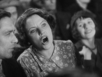 Movie still from “The 39 Steps” (1935), directed by Alfred Hitchcock – An old black and white photo of a woman screaming; Close Up shot, Low angle