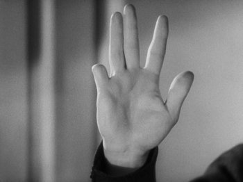 Movie still from “The 39 Steps” (1935), directed by Alfred Hitchcock – A person's hand is shown in a black and white photo; Extreme Close Up shot, High angle