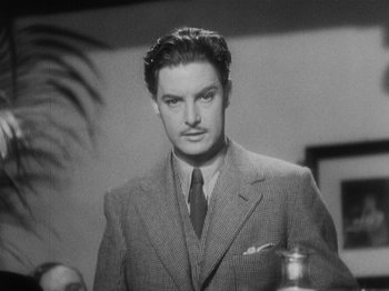Movie still from “The 39 Steps” (1935), directed by Alfred Hitchcock – A black and white photo of a man wearing a suit; Close Up shot, Low angle