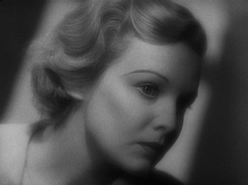 Movie still from “The 39 Steps” (1935), directed by Alfred Hitchcock – An old black and white photo of a woman's face; Close Up shot, High angle