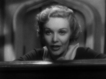 Movie still from “The 39 Steps” (1935), directed by Alfred Hitchcock – An old photo of a woman looking at the camera; Close Up shot, Low angle