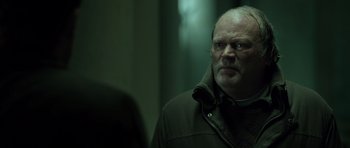 Movie still from “Department Q: The Absent One” (2014), directed by Mikkel Nørgaard – An older man with a goatee looking into a mirror; Close Up shot, Low angle