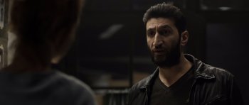 Movie still from “Department Q: The Absent One” (2014), directed by Mikkel Nørgaard – A man with a goatee talking to another man; Close Up shot, Over the shoulder angle