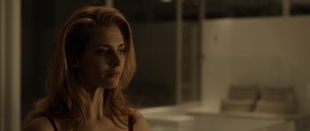 Movie still from “Department Q: The Absent One” (2014), directed by Mikkel Nørgaard – A woman with long red hair is looking into the distance; Close Up shot, Low angle