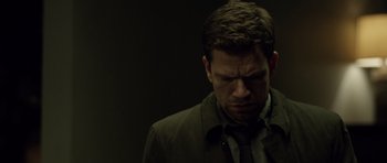 Movie still from “Department Q: The Absent One” (2014), directed by Mikkel Nørgaard – A person wearing a suit and tie; Close Up shot, Low angle