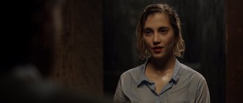 Movie still from “Department Q: The Absent One” (2014), directed by Mikkel Nørgaard – A woman with wet hair and a blue shirt; Close Up shot, Over the shoulder angle