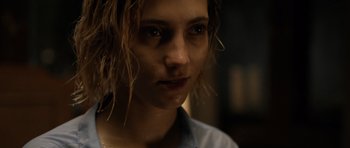 Movie still from “Department Q: The Absent One” (2014), directed by Mikkel Nørgaard – A woman's face in the dark; Close Up shot, Over the shoulder angle