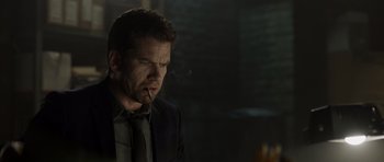 Movie still from “Department Q: The Absent One” (2014), directed by Mikkel Nørgaard – A person smoking a cigarette; Close Up shot, Low angle