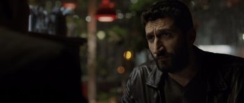 Movie still from “Department Q: The Absent One” (2014), directed by Mikkel Nørgaard – A person wearing a leather jacket; Close Up shot, Over the shoulder angle