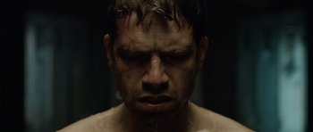 Movie still from “Department Q: The Absent One” (2014), directed by Mikkel Nørgaard – A person with wet hair; Close Up shot, Low angle