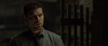 Movie still from “Department Q: The Absent One” (2014), directed by Mikkel Nørgaard – A person wearing a shirt and a tie; Close Up shot, Over the shoulder angle