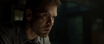 Movie still from “Department Q: The Absent One” (2014), directed by Mikkel Nørgaard – A person looking at the camera; Close Up shot, Over the shoulder angle