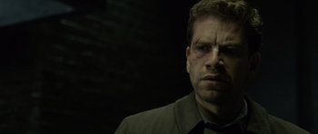 Movie still from “Department Q: The Absent One” (2014), directed by Mikkel Nørgaard – A person wearing a shirt; Close Up shot, Over the shoulder angle