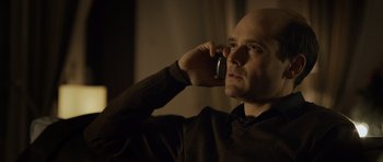 Movie still from “Department Q: The Absent One” (2014), directed by Mikkel Nørgaard – A man is talking on a cell phone; Close Up shot, Low angle