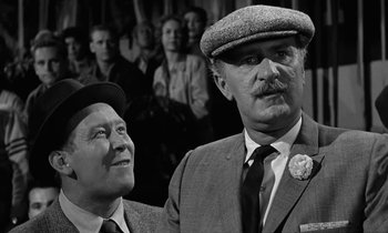 Movie still from “The Absent Minded Professor” (1961), directed by Robert Stevenson – A man and a man in a suit and tie; Close Up shot, Low angle