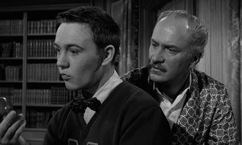 Movie still from “The Absent Minded Professor” (1961), directed by Robert Stevenson – A man and a young boy in a room; Medium shot, Over the shoulder angle