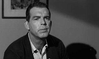 Movie still from “The Absent Minded Professor” (1961), directed by Robert Stevenson – Black and white photograph of a man in a suit; Close Up shot, Over the shoulder angle