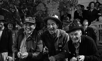 Movie still from “The Absent Minded Professor” (1961), directed by Robert Stevenson – A black and white photo of a group of old men; Medium shot, High angle