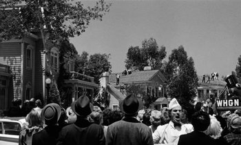 Movie still from “The Absent Minded Professor” (1961), directed by Robert Stevenson – A crowd of people standing in front of a building; Extreme Wide shot, Low angle