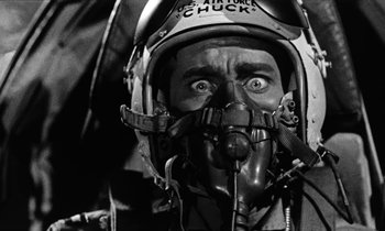 Movie still from “The Absent Minded Professor” (1961), directed by Robert Stevenson – A man in a fighter pilot's helmet and goggles; Close Up shot, Low angle