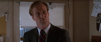 Movie still from “The Accidental Tourist” (1988), directed by Lawrence Kasdan – A man in a suit and a tie; Close Up shot, Low angle