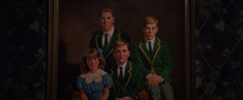 Movie still from “The Accidental Tourist” (1988), directed by Lawrence Kasdan – A painting of four young men and a little girl; Extreme Close Up shot, High angle