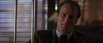 Movie still from “The Accidental Tourist” (1988), directed by Lawrence Kasdan – A man in a suit and tie; Close Up shot, Low angle