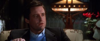 Movie still from “The Accidental Tourist” (1988), directed by Lawrence Kasdan – A person wearing a suit and tie; Close Up shot, Low angle