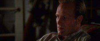 Movie still from “The Accidental Tourist” (1988), directed by Lawrence Kasdan – A person sitting down; Close Up shot, Low angle