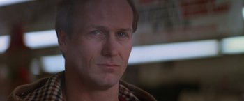 Movie still from “The Accidental Tourist” (1988), directed by Lawrence Kasdan – A man's face with a blurry background; Close Up shot, Low angle