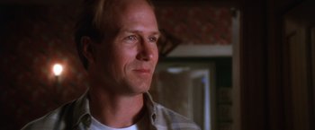 Movie still from “The Accidental Tourist” (1988), directed by Lawrence Kasdan – A person wearing a white shirt; Close Up shot, Low angle