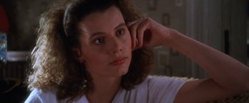 Movie still from “The Accidental Tourist” (1988), directed by Lawrence Kasdan – A person wearing a white shirt; Close Up shot, High angle