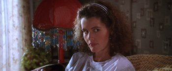 Movie still from “The Accidental Tourist” (1988), directed by Lawrence Kasdan – A person wearing a white shirt; Close Up shot, Low angle