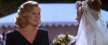 Movie still from “The Accidental Tourist” (1988), directed by Lawrence Kasdan – A woman and a man are talking to each other; Close Up shot, Over the shoulder angle