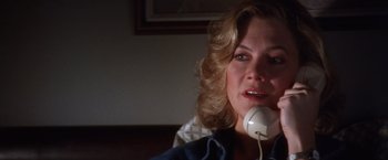 Movie still from “The Accidental Tourist” (1988), directed by Lawrence Kasdan – A person talking on a phone; Close Up shot, High angle