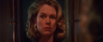 Movie still from “The Accidental Tourist” (1988), directed by Lawrence Kasdan – A person wearing a dress; Close Up shot, Over the shoulder angle