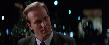 Movie still from “The Accidental Tourist” (1988), directed by Lawrence Kasdan – A man in a suit and tie looking to his left; Close Up shot, Low angle