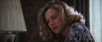 Movie still from “The Accidental Tourist” (1988), directed by Lawrence Kasdan – A person with blonde hair; Close Up shot, Low angle