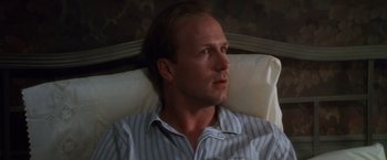 Movie still from “The Accidental Tourist” (1988), directed by Lawrence Kasdan – A person laying in a bed; Close Up shot, High angle